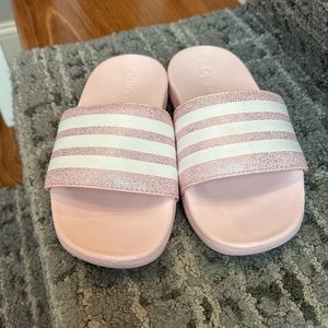 Light pink and white adidas slip on sandals